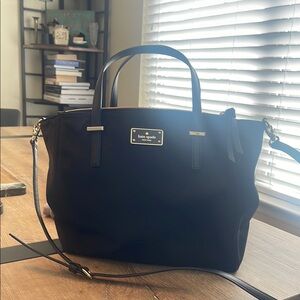Kate Spade. Minimal use. Nice compartments for organizing. Stylish and chic.